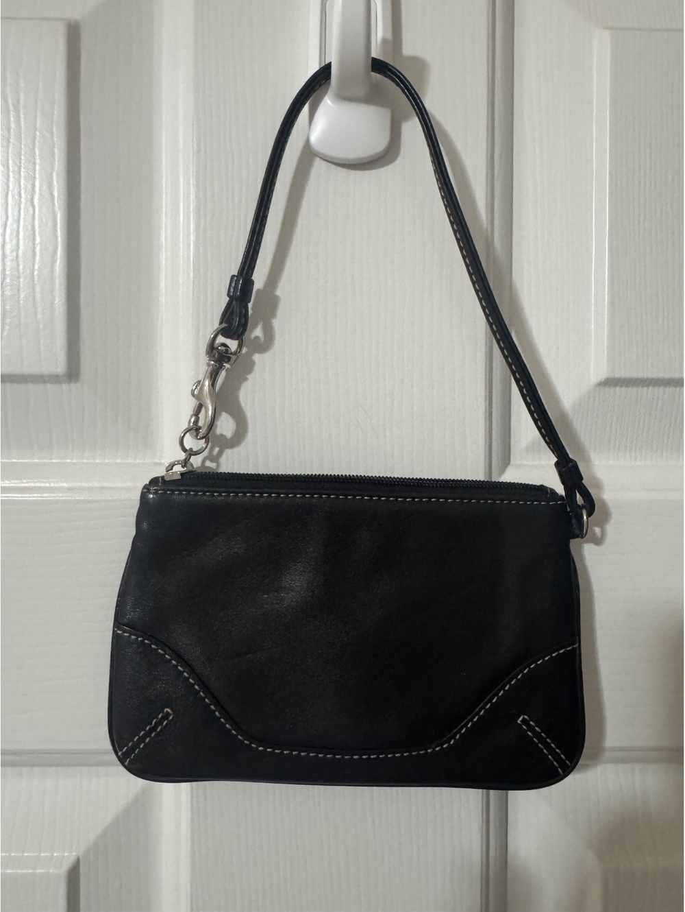 C49. Coach black leather wristlet